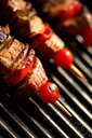 barbecue - meat that has been barbecued or grilled in a highly seasoned sauce