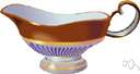 gravy boat - a dish (often boat-shaped) for serving gravy or sauce
