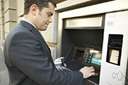 automatic teller - an unattended machine (outside some banks) that dispenses money when a personal coded card is used