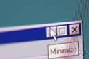 minimisation - the act of reducing something to the least possible amount or degree or position