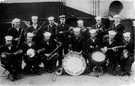 military band - a group of musicians playing brass and woodwind and percussion instruments