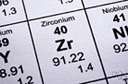 zirconium - a lustrous grey strong metallic element resembling titanium