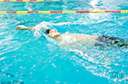 backstroke - a swimming stroke that resembles the crawl except the swimmer lies on his or her back