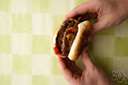 burger - a sandwich consisting of a fried cake of minced beef served on a bun, often with other ingredients