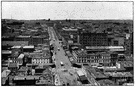 main street - street that serves as a principal thoroughfare for traffic in a town