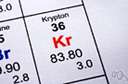 Kr - a colorless element that is one of the six inert gasses